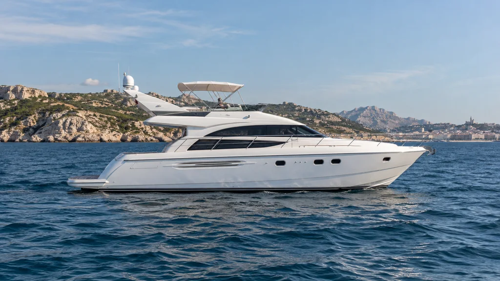 Unbranded white motor yacht on slightly textured Mediterranean water off Marseille